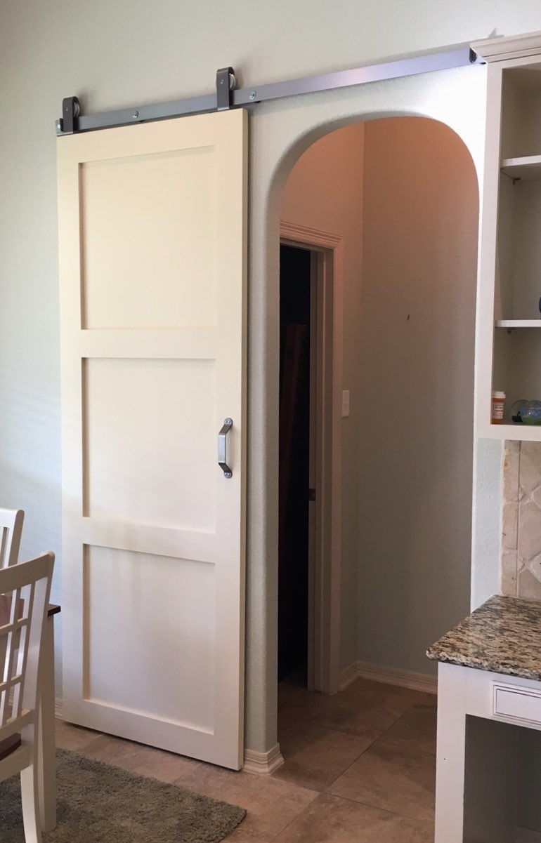 Quaker style barn door in New York kitchen.